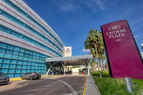 a building with a car parked in front of it at Crowne Plaza Leon by IHG in León