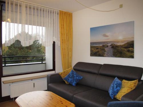 a living room with a couch and a window at Apartment Anke by Interhome in Damp