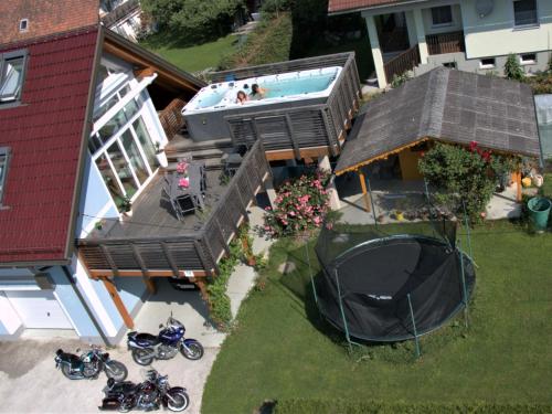 an overhead view of a house with a swimming pool and motorcycles at Apartment Ligist by Interhome in Ligist