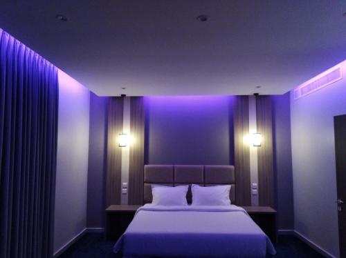 Ένα ή περισσότερα κρεβάτια σε δωμάτιο στο Golden House Dammam