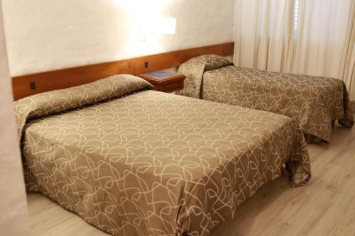 
Una cama o camas en una habitación de Hotel Posta del Sol Paraná
