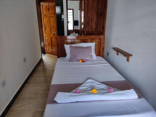 Postel nebo postele na pokoji v ubytování La Residence D'Almee Guesthouse
