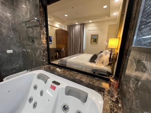 Ein Bett oder Betten in einem Zimmer der Unterkunft Hotel Golden Palace
