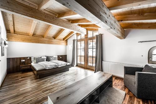 a living room with a bed and a couch at Chalet Angela in Obergurgl