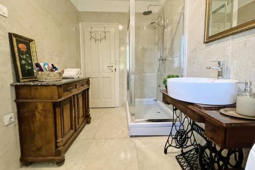 a bathroom with a sink and a shower at Apartman Soda in Ogulin