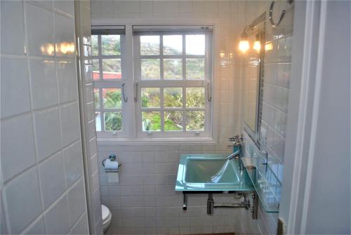 a bathroom with a sink and a window at La Palma Ocean View in Villa de Mazo