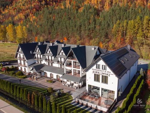 an aerial view of a building with a roof at Pensjonat Jurkowski Wellness & Spa in Ochotnica Dolna