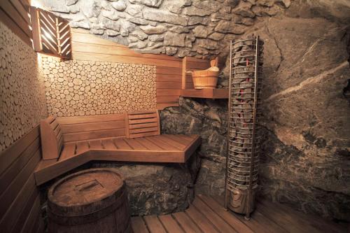 a sauna with a wooden bench and a ladder at Divina Vita Apartments in Varenna