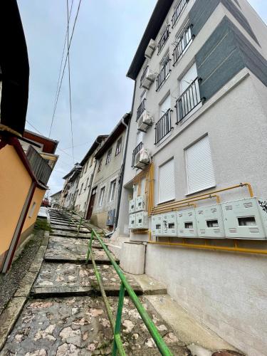 a building with a green hose in front of it at Like Home 1 in Sarajevo