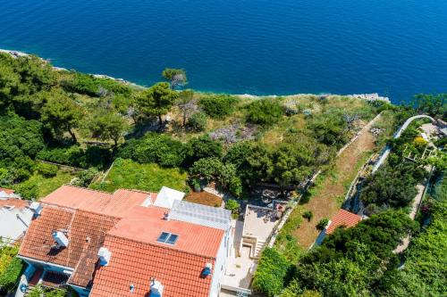 an aerial view of a house next to the water at Apartment Edita in Dubrovnik