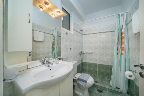 Ванная комната в Villa Mounda Apollon