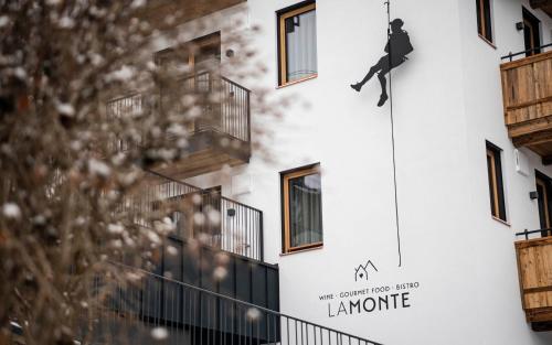 a building with a sign on the side of it at LaMonte Luxury Apartments in Kitzbühel