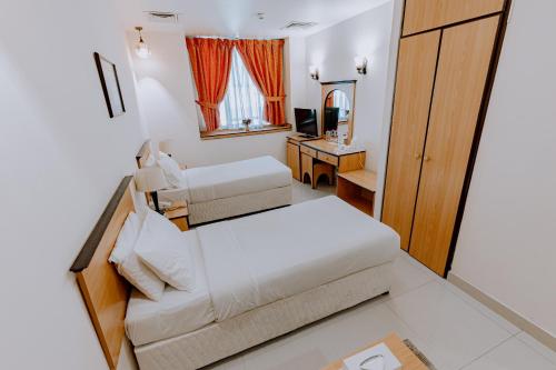 En eller flere senge i et værelse på Panorama Hotel Deira