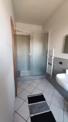 a bathroom with a shower and a sink at I capricci dell' Etna suite in Mascalucia