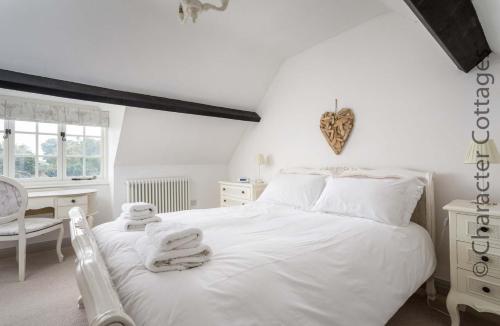 מיטה או מיטות בחדר ב-Willow Vale