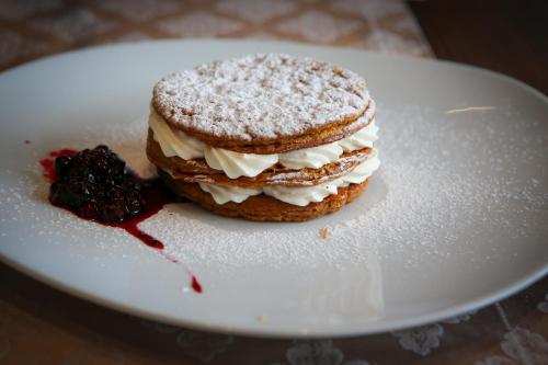 a stack of ice cream sandwiches on a white plate at ADAM Hotel Suites in Tunis