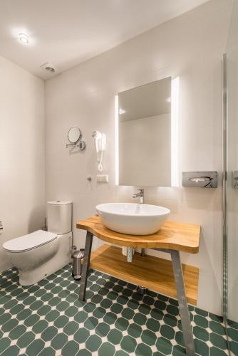 Koupelna v ubytování Hotel Miķelis