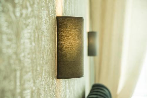 a light on the side of a window at Cozy 3 bedroom apartament in town centre of Joniškis in Joniškis
