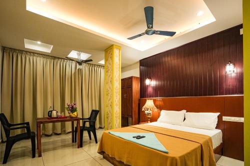 Postel nebo postele na pokoji v ubytování Melanna Cherai Beach Resorts