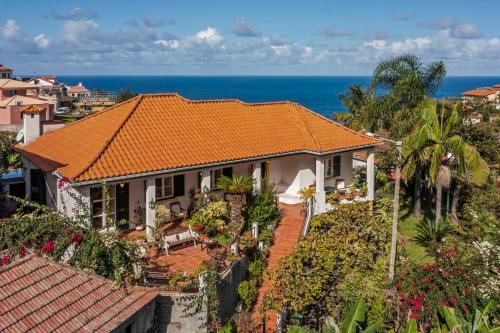an aerial view of a house with an orange roof at Casa dos Terços by An Island Apart in São Vicente