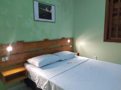 מיטה או מיטות בחדר ב-Casa com piscina - Prado