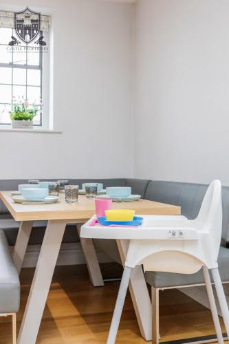 a table with bowls and plates on it at Castle Properties:Eton-The College in Windsor