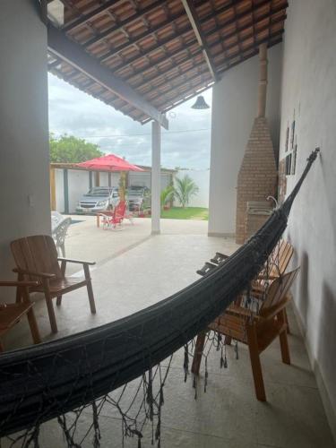 a large boat hanging from the side of a house at Casa com piscina - Prado in Prado