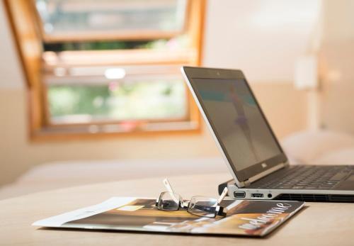 a laptop computer sitting on top of a table at Apartamentos Portazgo in A Coruña