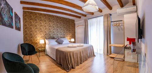 
A bed or beds in a room at El Palauet del Priorat
