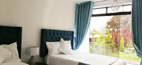 Postel nebo postele na pokoji v ubytování Hotel Magdalena Campestre