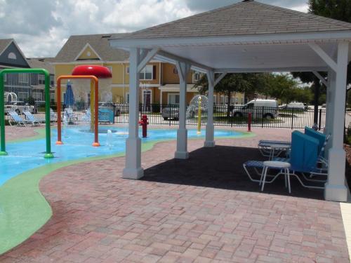 a playground with a pavilion and a water park at Villas at Seven Dwarfs Lane Resort in Kissimmee
