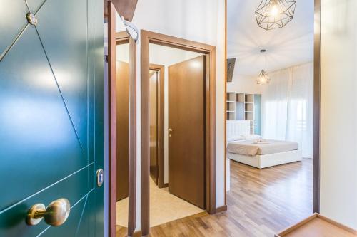 a hallway with a door leading to a bedroom at 4 Star Family & Friends Apt - Self Check-in in Bologna