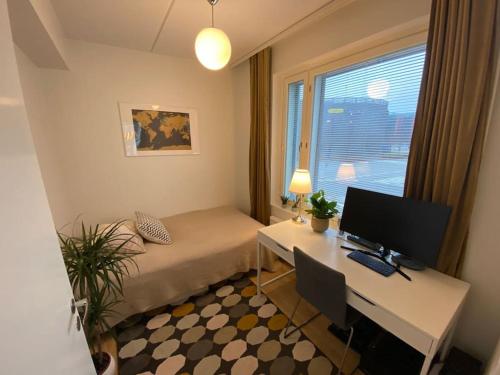 A television and/or entertainment center at Modern two bedroom apartment near Helsinki Airport