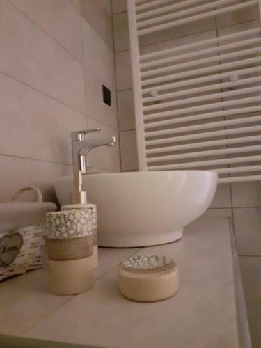a bathroom with a sink and a white sink at The view attic in Ioannina