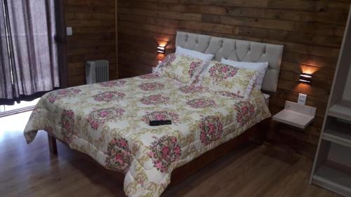מיטה או מיטות בחדר ב-Pousada Sitio Bella Vista