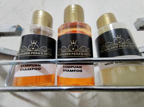 four bottles of honey on a shelf at The Golden Pera's Hotel & Spa in Istanbul