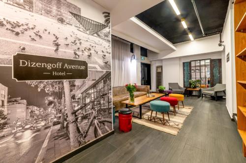 a lobby of a hotel with a sign that reads divergent avenue hotel at Dizengoff Avenue Boutique Hotel in Tel Aviv