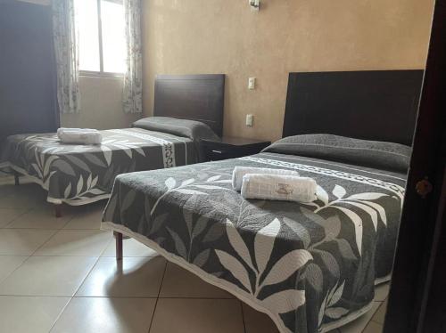 Säng eller sängar i ett rum på Hotel San Salvador