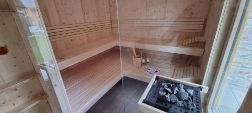 an inside view of a sauna with a glass wall at Wellness Chalet Bell a Mur in Murau