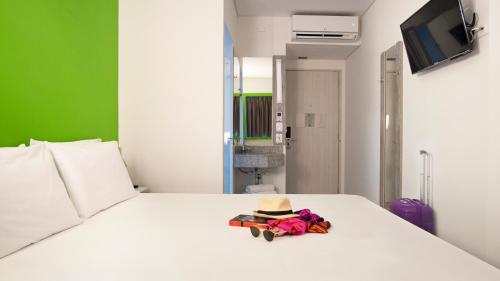 Säng eller sängar i ett rum på ibis budget Barranquilla