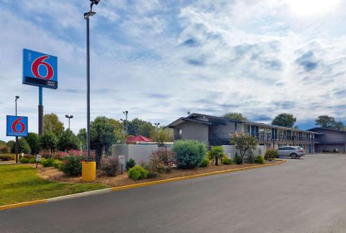 a building with a sign on the side of a road at Motel 6-Columbus, GA in Columbus