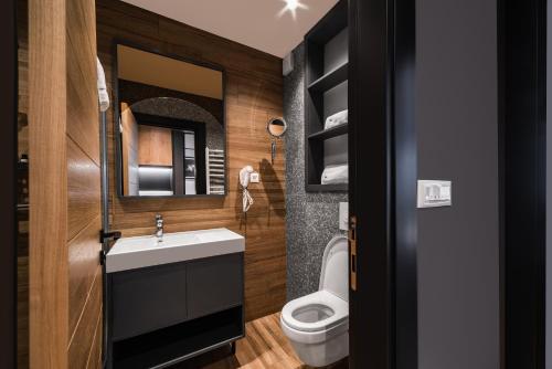 a bathroom with a sink and a toilet at Modern Mountain La Stella in Kolašin