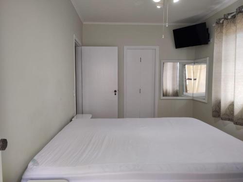 Cama ou camas em um quarto em Apto Itaguá - Ubatuba