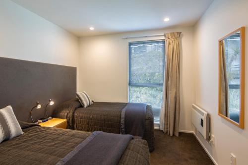 Ένα ή περισσότερα κρεβάτια σε δωμάτιο στο Blue Peaks Apartments