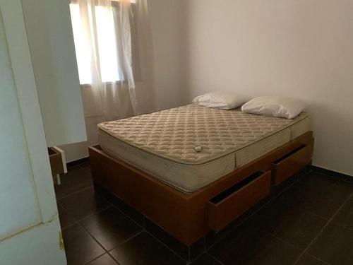 Una cama o camas en una habitación de Pousada Familiar Morada do Rapha