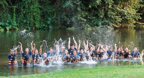 a group of people are in the water at Vimannam Resort in Phetchaburi