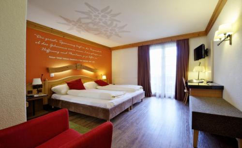 Postel nebo postele na pokoji v ubytování Hotel Kirchbühl Superior