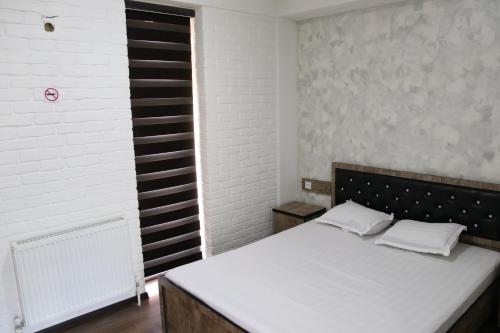 Кровать или кровати в номере Orion Hotel Tashkent