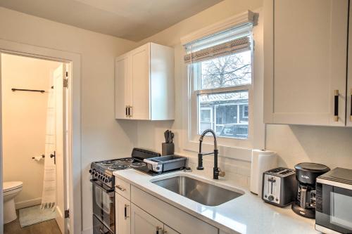 a kitchen with a sink and a stove and a window at Modern-Chic Studio about 1 Mile to Dtwn Spokane! in Spokane
