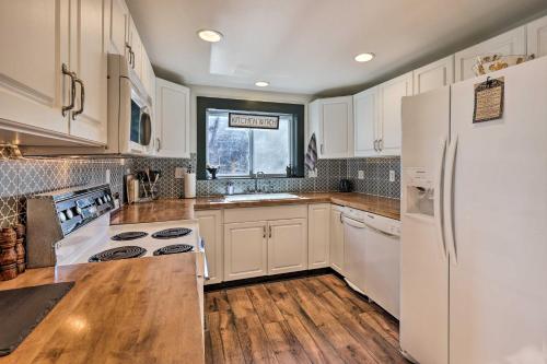 a kitchen with white cabinets and a white refrigerator at Pet-Friendly Fries Home Less Than 6 Mi to New River! in Independence